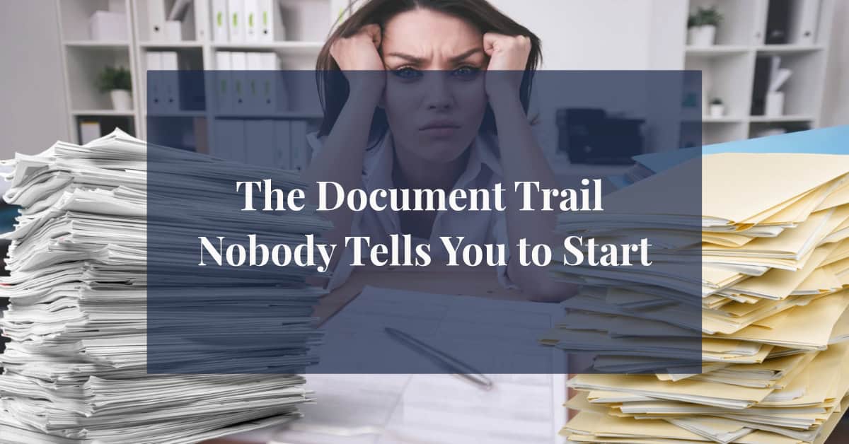 Woman overwhelmed by towering stacks of chronic illness documentation on her desk